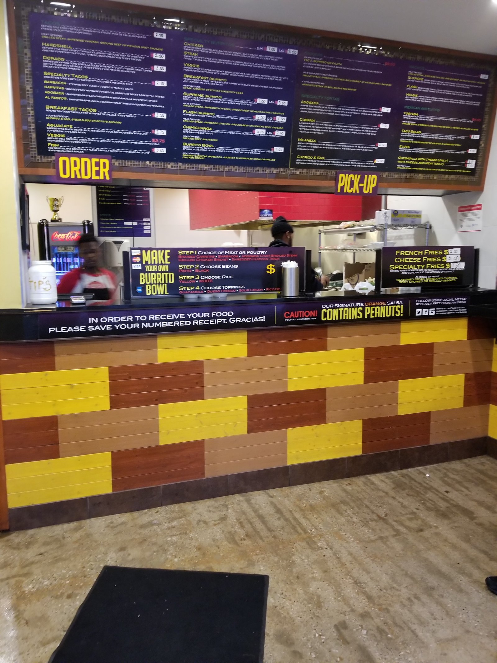 Ordering counter with overhead menu boards and ORDER/PICK-UP signs