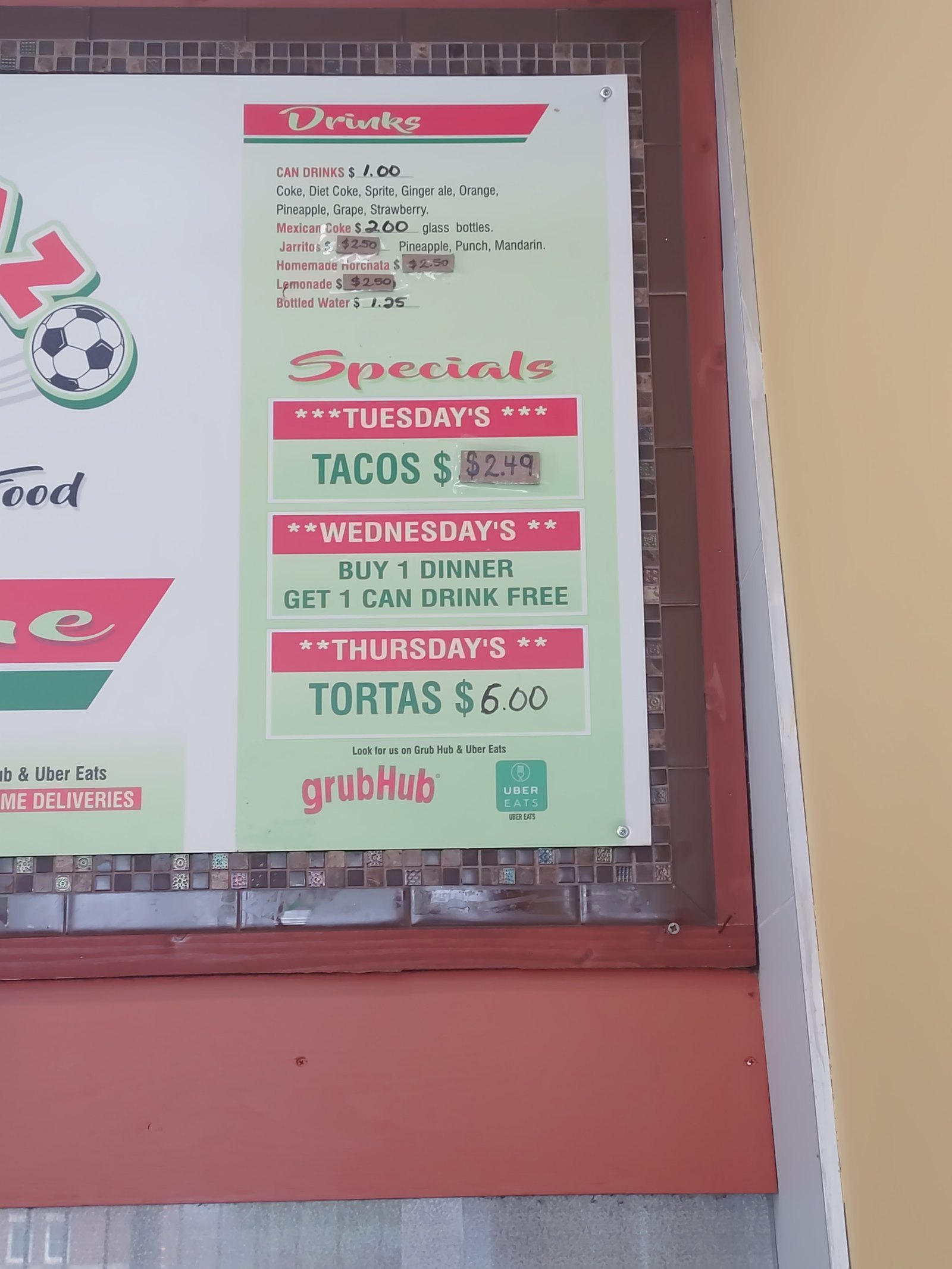 Menu board with drink prices and weekly specials