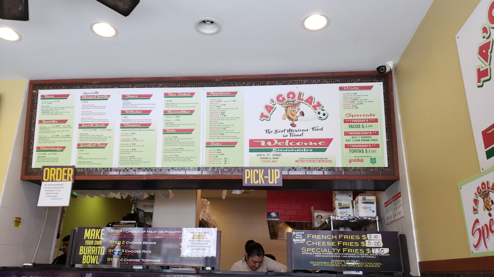 Overhead menu board at the counter; older Taco Xola branding is visible
